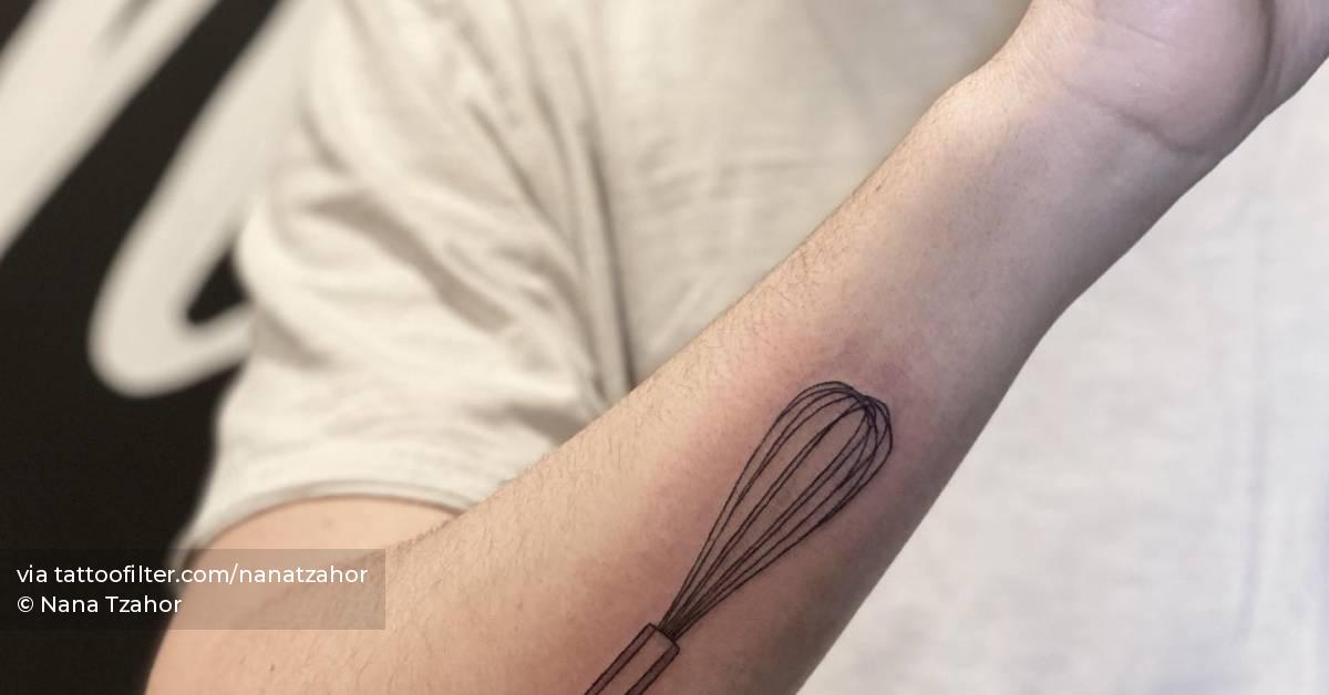 Fine line whisk tattoo located on the forearm.