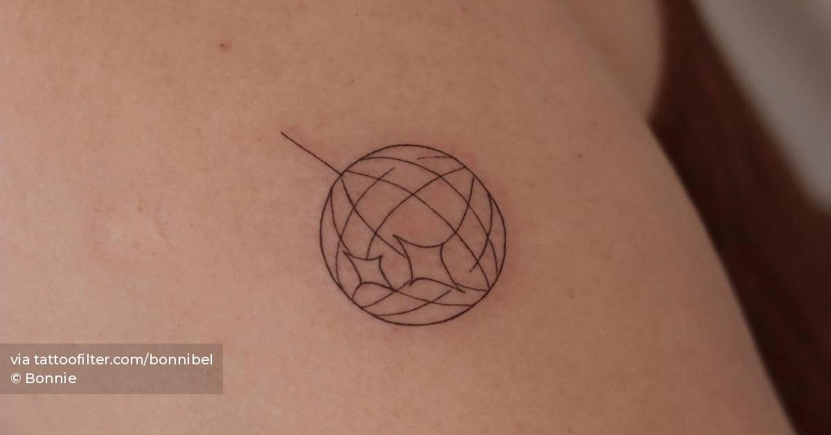 Fine line disco ball tattoo located on the upper arm.
