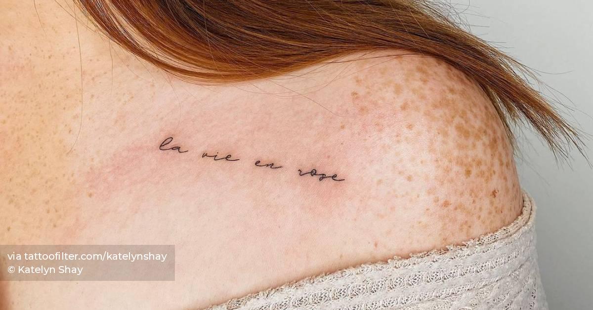 "La vie en rose" lettering tattoo located on the