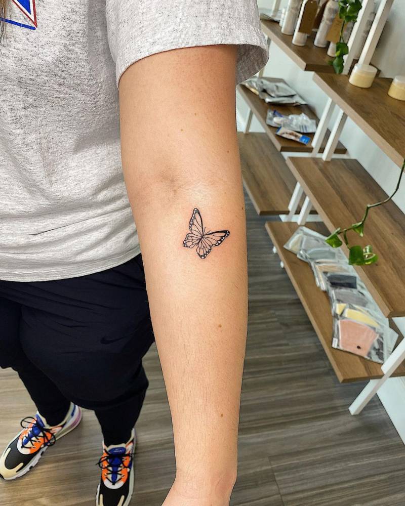 Tattoo of a butterfly done on the forearm.