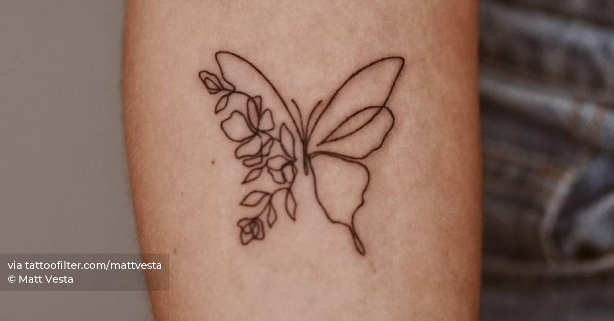 Half butterfly half flower tattoo located on the inner