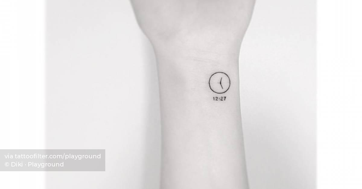 Minimalistic clock tattoo located on the wrist.