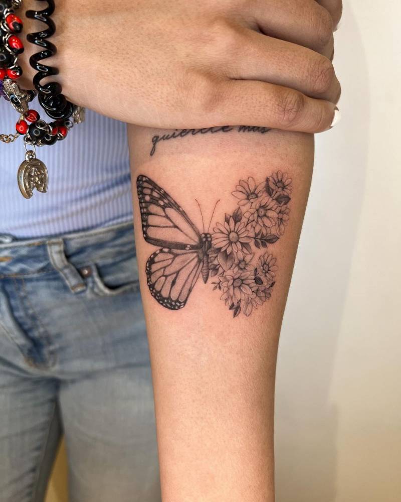 Half butterfly half flowers tattoo done on the inner