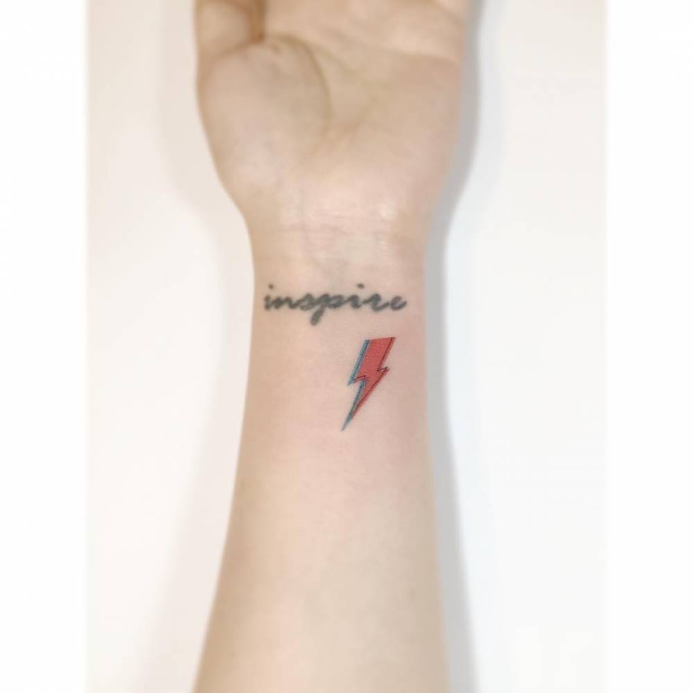 David Bowie's lightning bolt tattooed on the wrist,