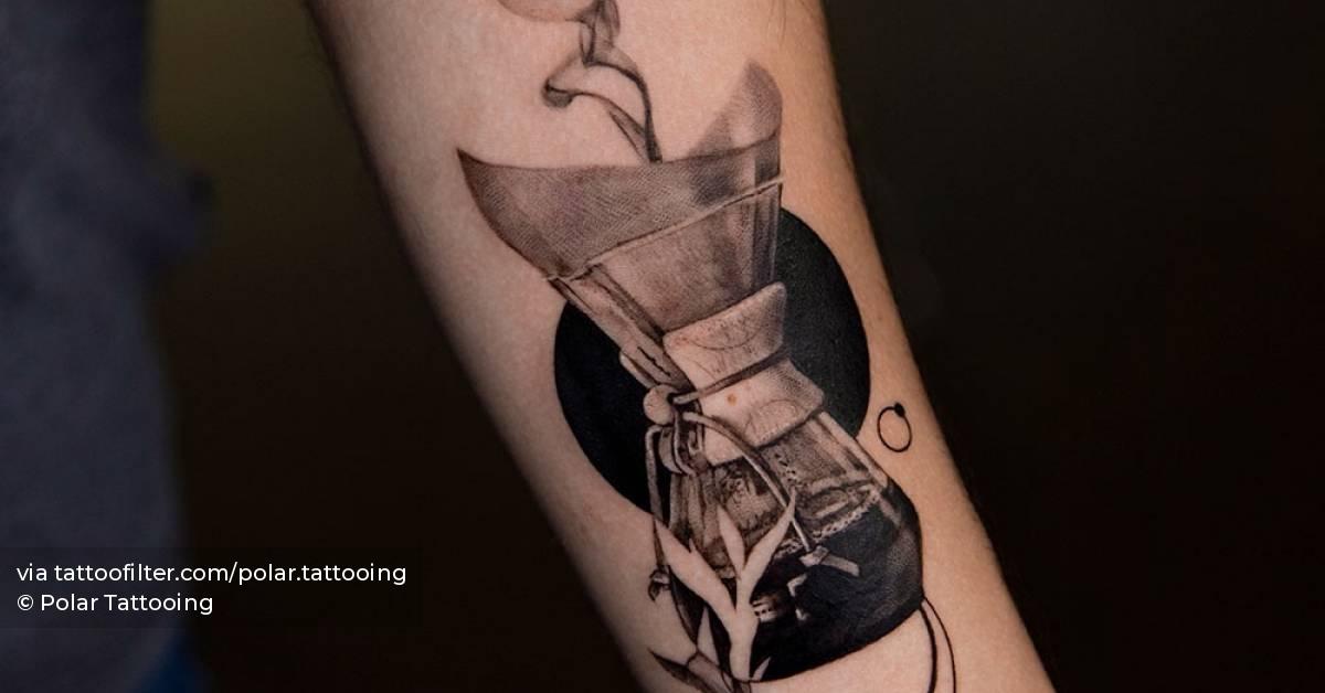 Black and grey coffee filter tattoo located on the