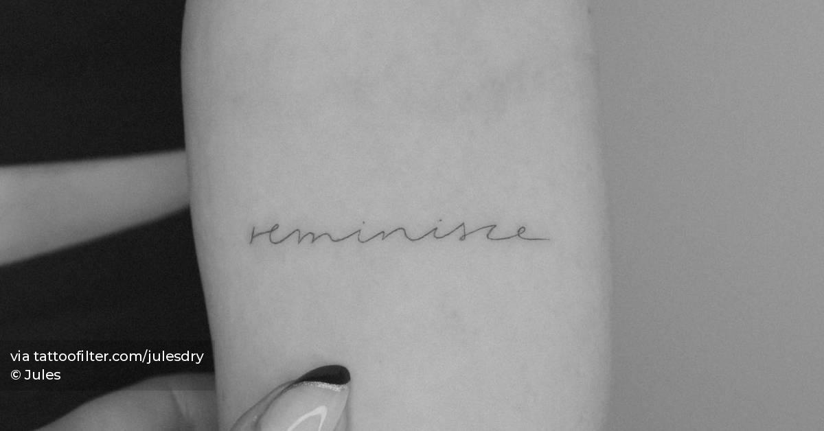 Tattoo of the word "reminisce" located on the inner