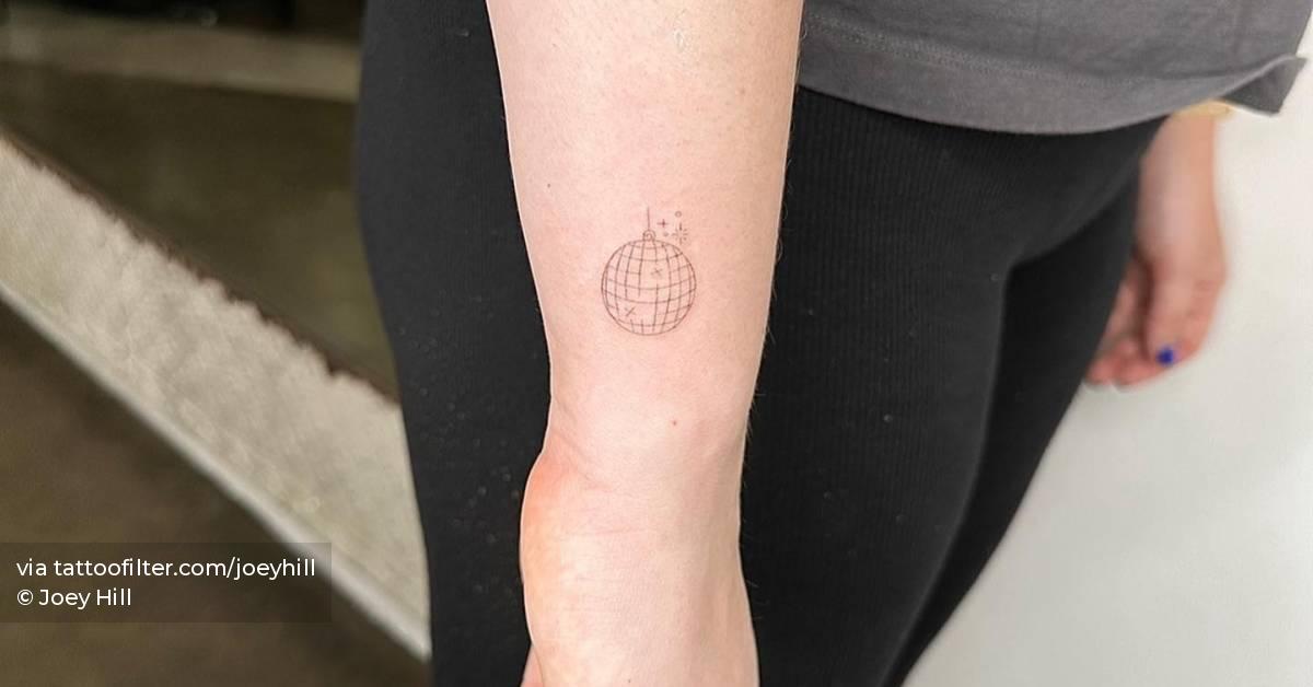 Single needle disco ball tattoo done on the wrist.
