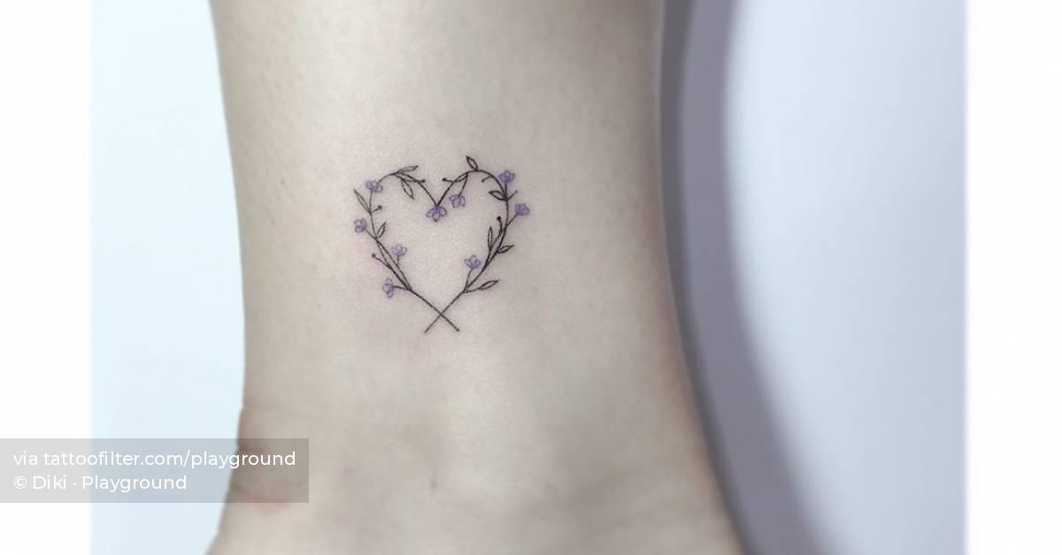 Flower heart tattoo placed on the ankle, fine line