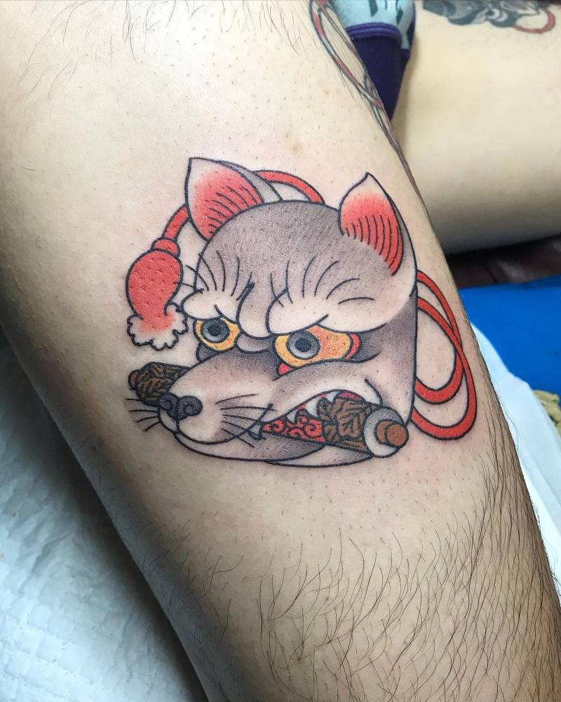 Kitsune tattoo placed on the thigh.