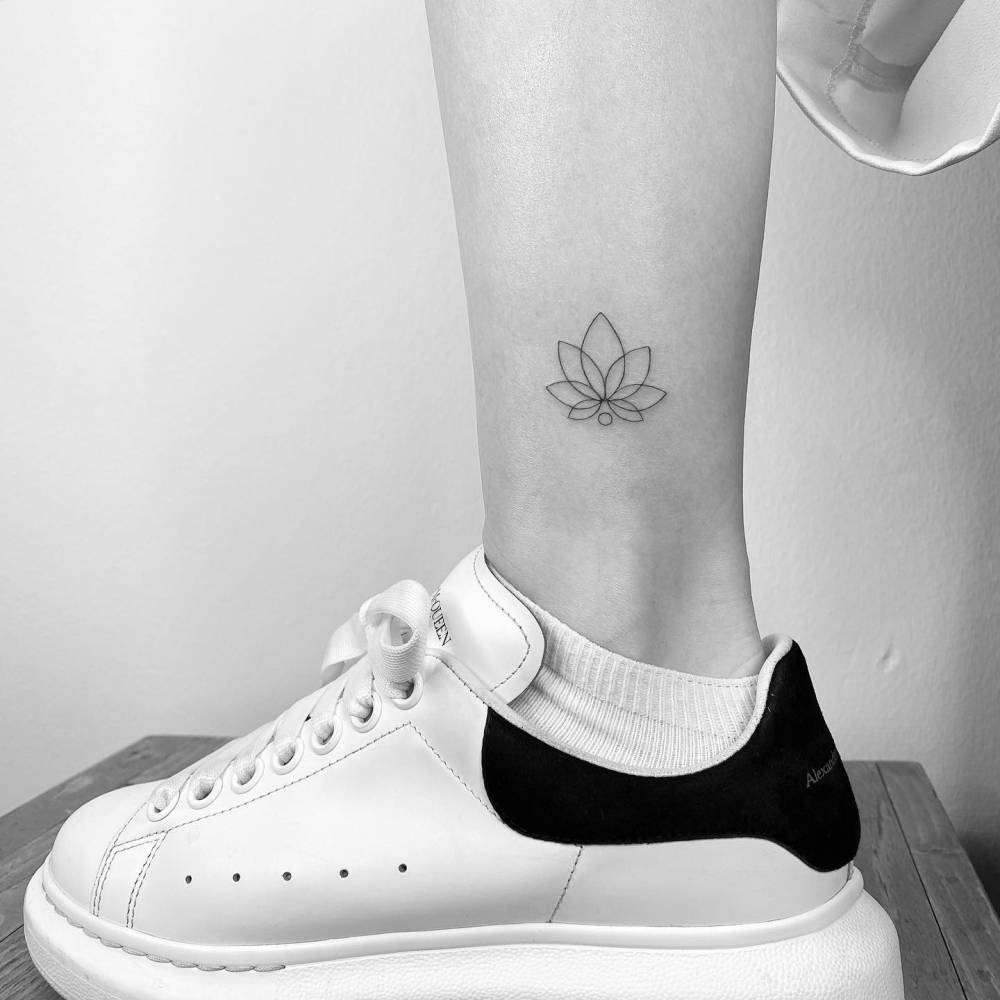 Minimalistic lotus flower tattoo done on the ankle.
