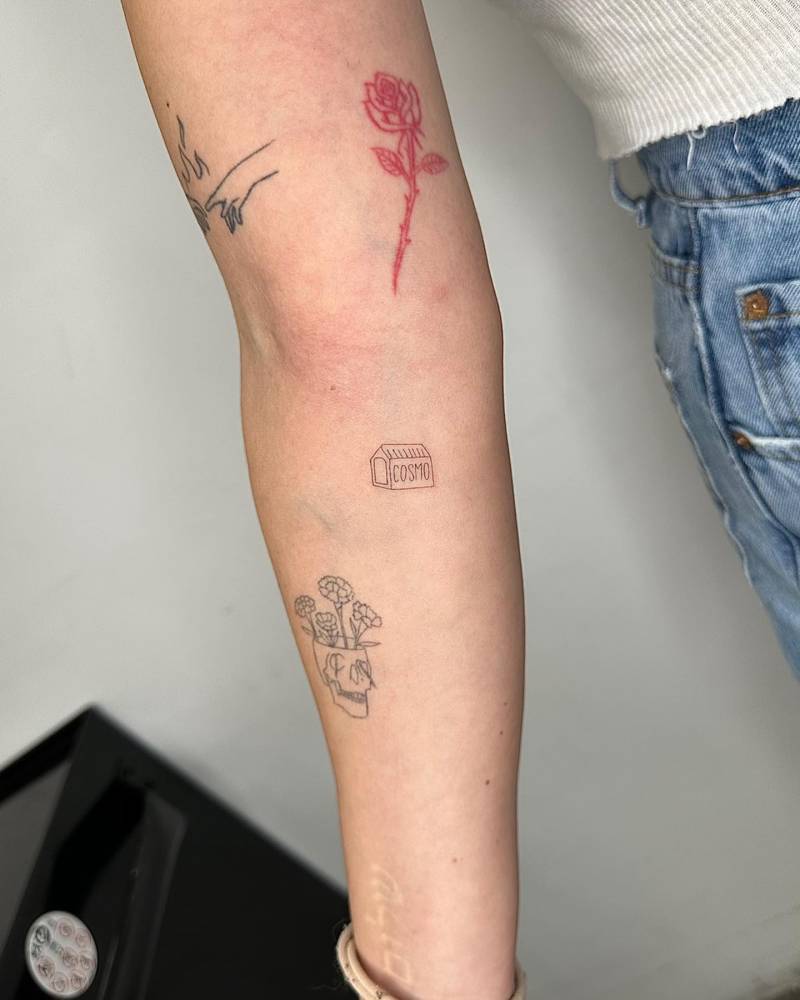 Doghouse tattoo located on the inner forearm, fine line