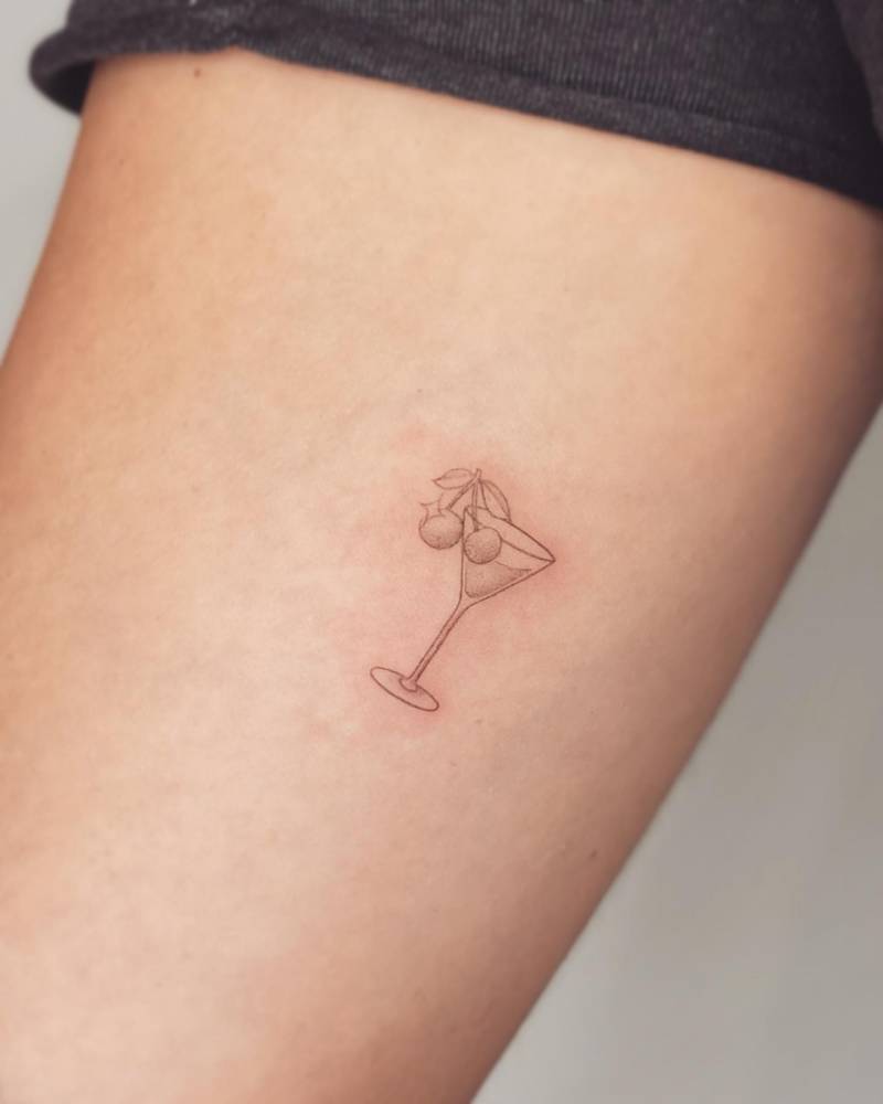 Cherry Martini tattoo located on the inner forearm.