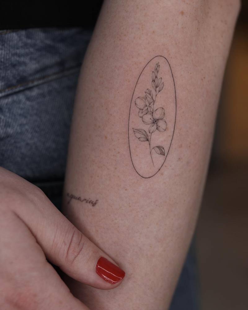 Veronica flower tattoo located on the forearm,