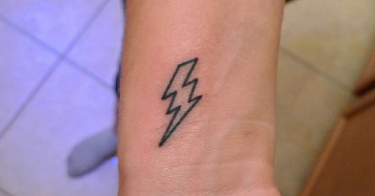 Lightning bolt tattoo on the inner right wrist.