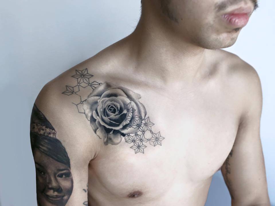 Graphic style rose tattoo on the right