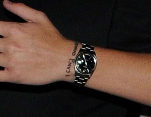 “I can’t change” tattoo on Harry Styles� left