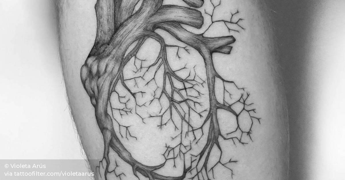 Fine line style anatomical heart tattoo on the left