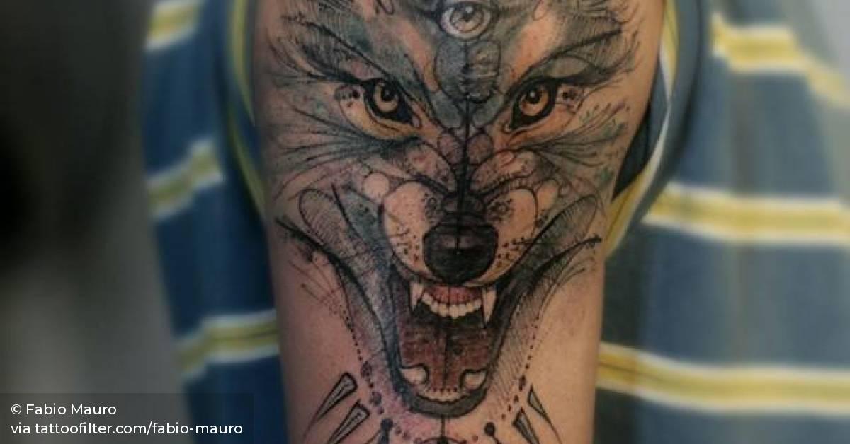 Sketchy style three eyed wolf tattoo on the right upper