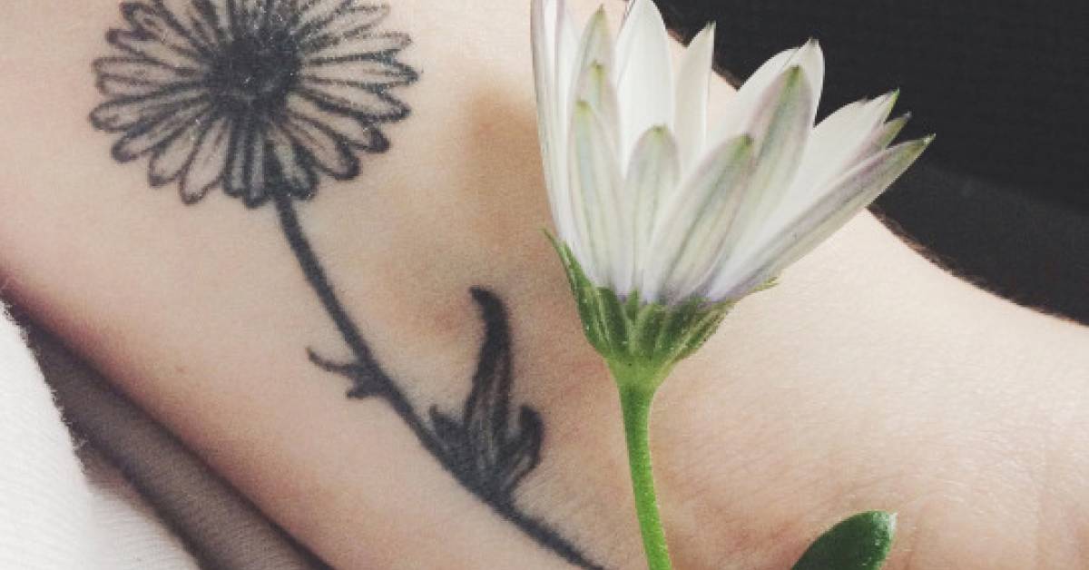 Small Wrist Tattoo Of A Daisy On Clara. 628_x_1200_jpg