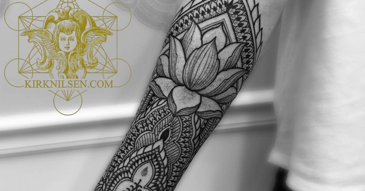 Henna style right inner forearm tattoo.