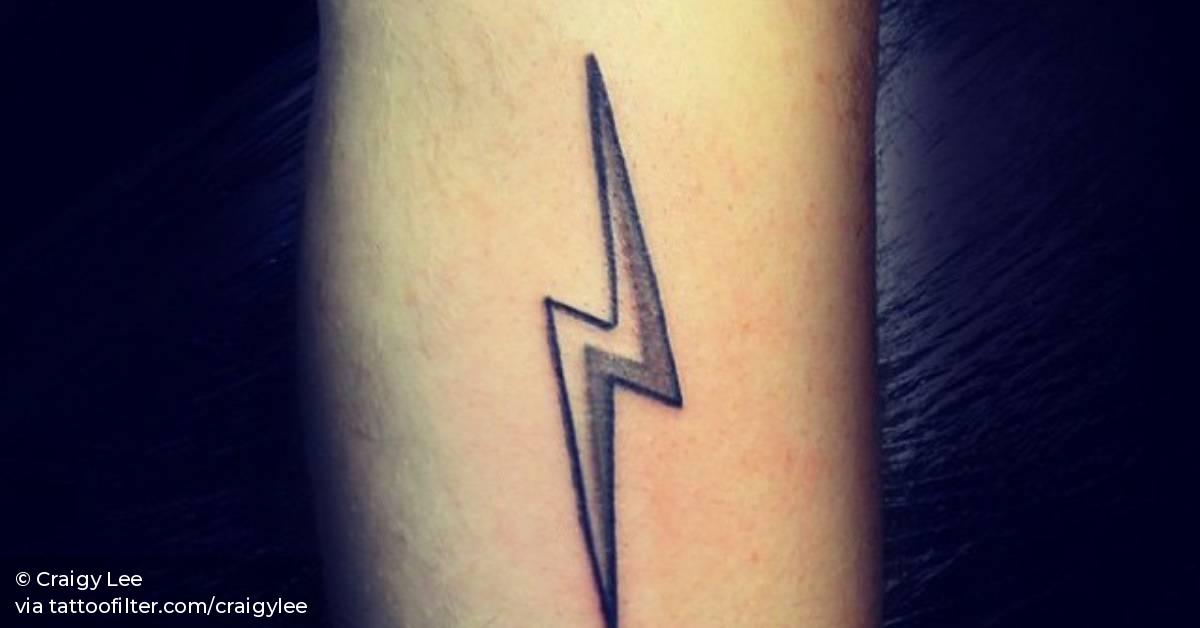 Forearm tattoo of a lightning bolt by Craigy Lee.