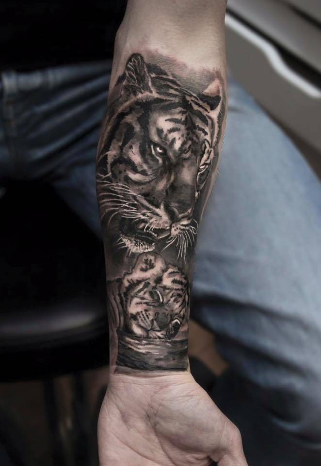 Black and grey style tiger and baby tiger tattoo on the