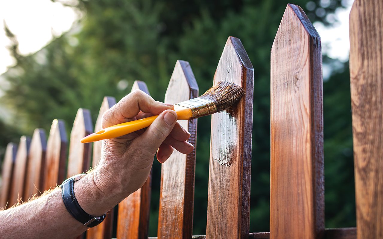 What are the benefits of sealing and treating a fence?