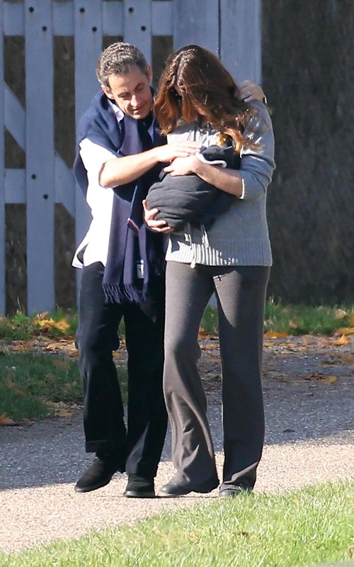 Nicolas and Carla Bruni Sarkozy Take Newborn Daughter For A Walk