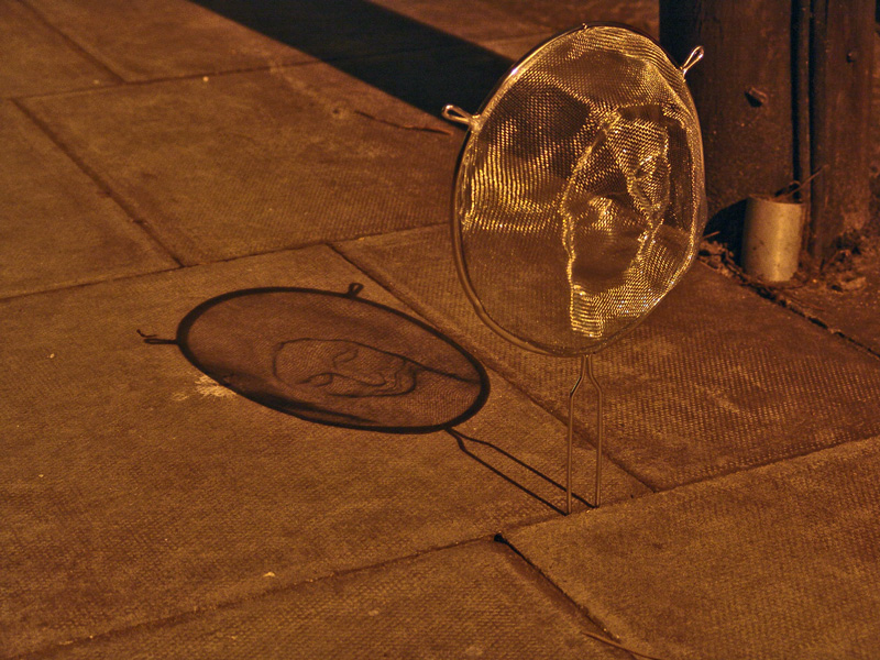 Strainers faces Isaac Cordal