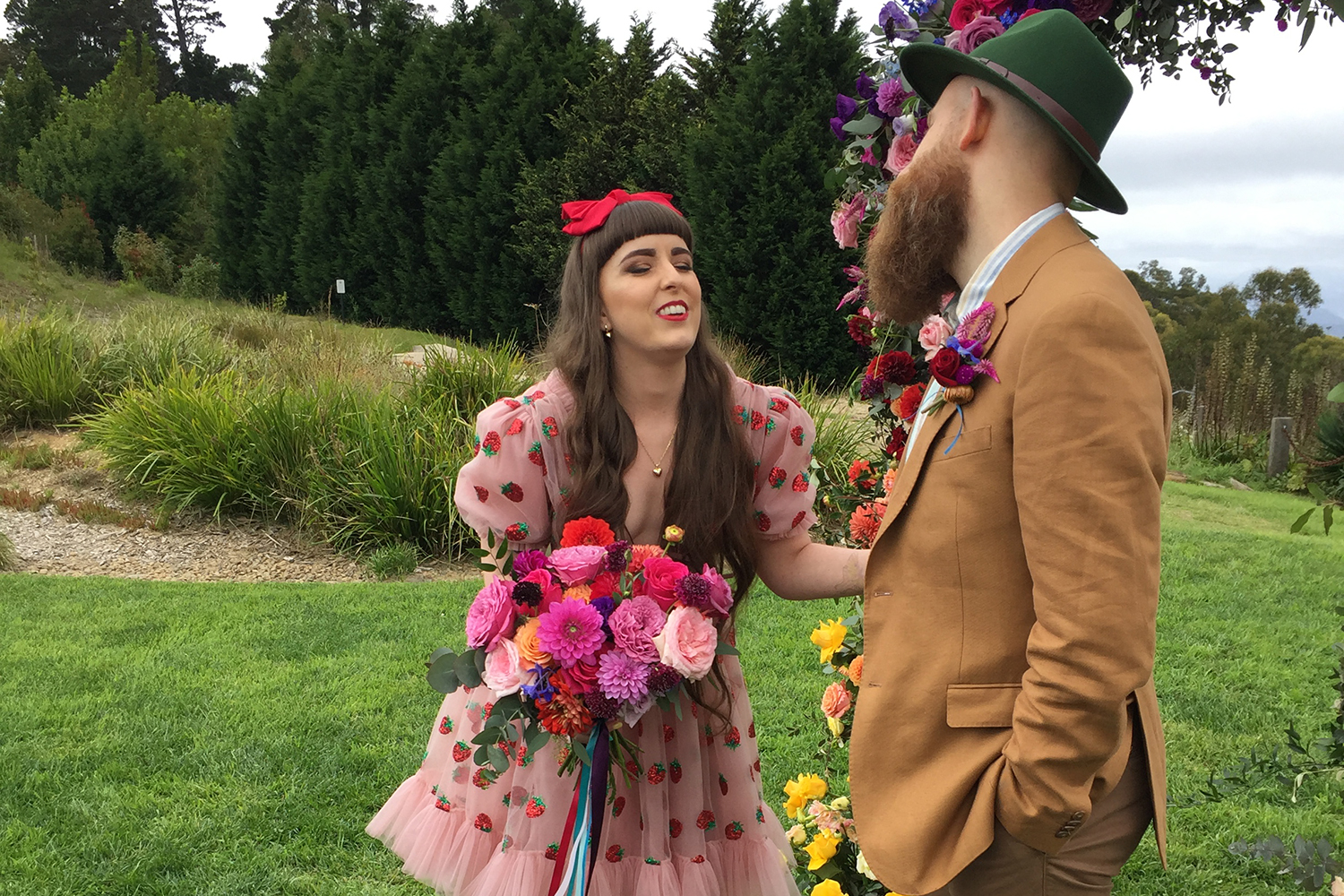 What is the meaning behind those flowers men wear at weddings?
