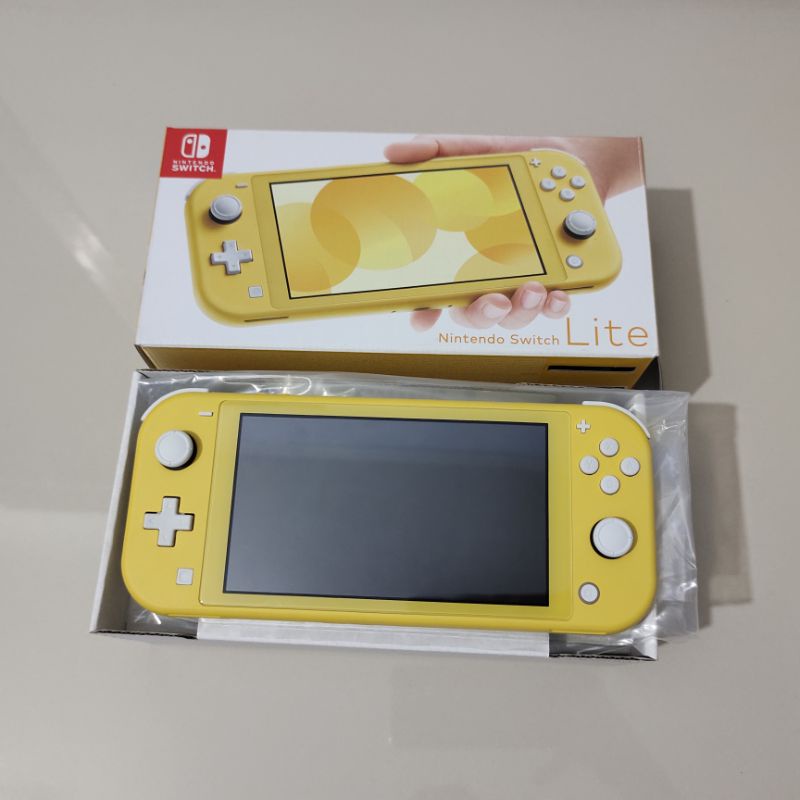 Jual Nintendo Switch Lite Yellow Like New | Shopee Indonesia