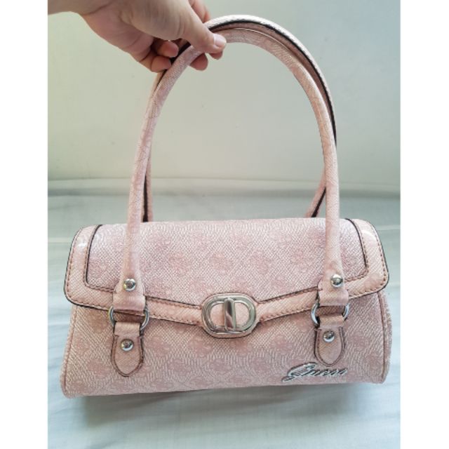 preloved light pink Guess handbag with bag charms Shopee Philippines
