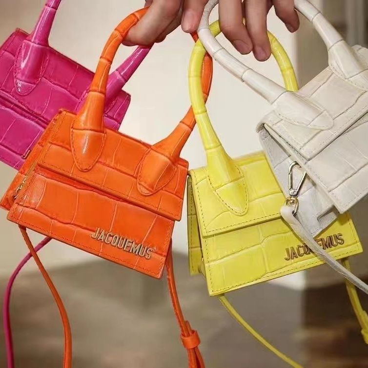 Jacquemus Mini hand x oblique satchel alligator striped handbag