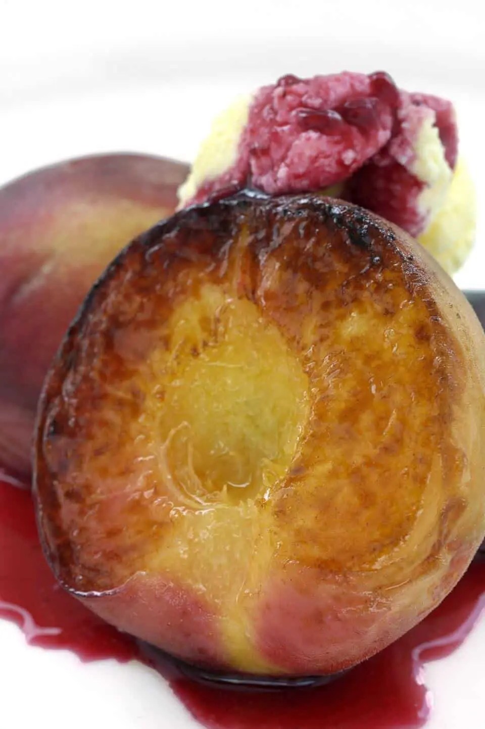 Grilled Peaches with Amaretto Mascarpone Chefs Pencil