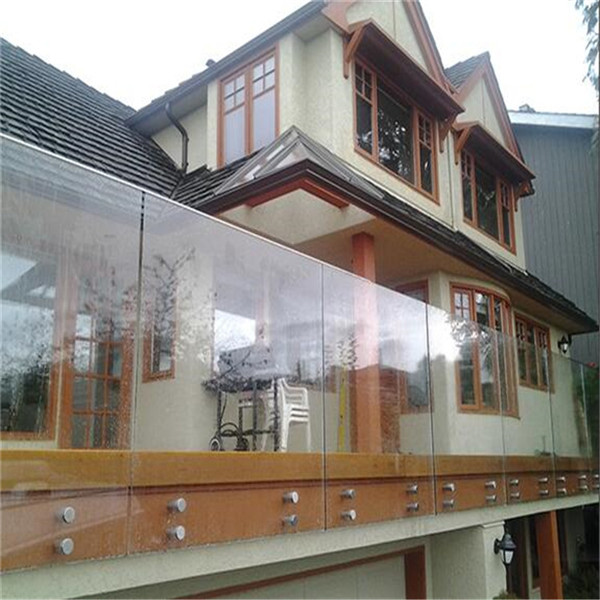 Outdoor side mounted glass balustrade with stainless steel standoff