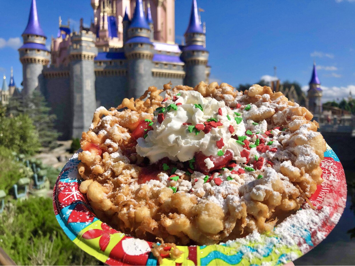 Fa La La La Funnel Cake wowing guests at the Magic Kingdom Chip and