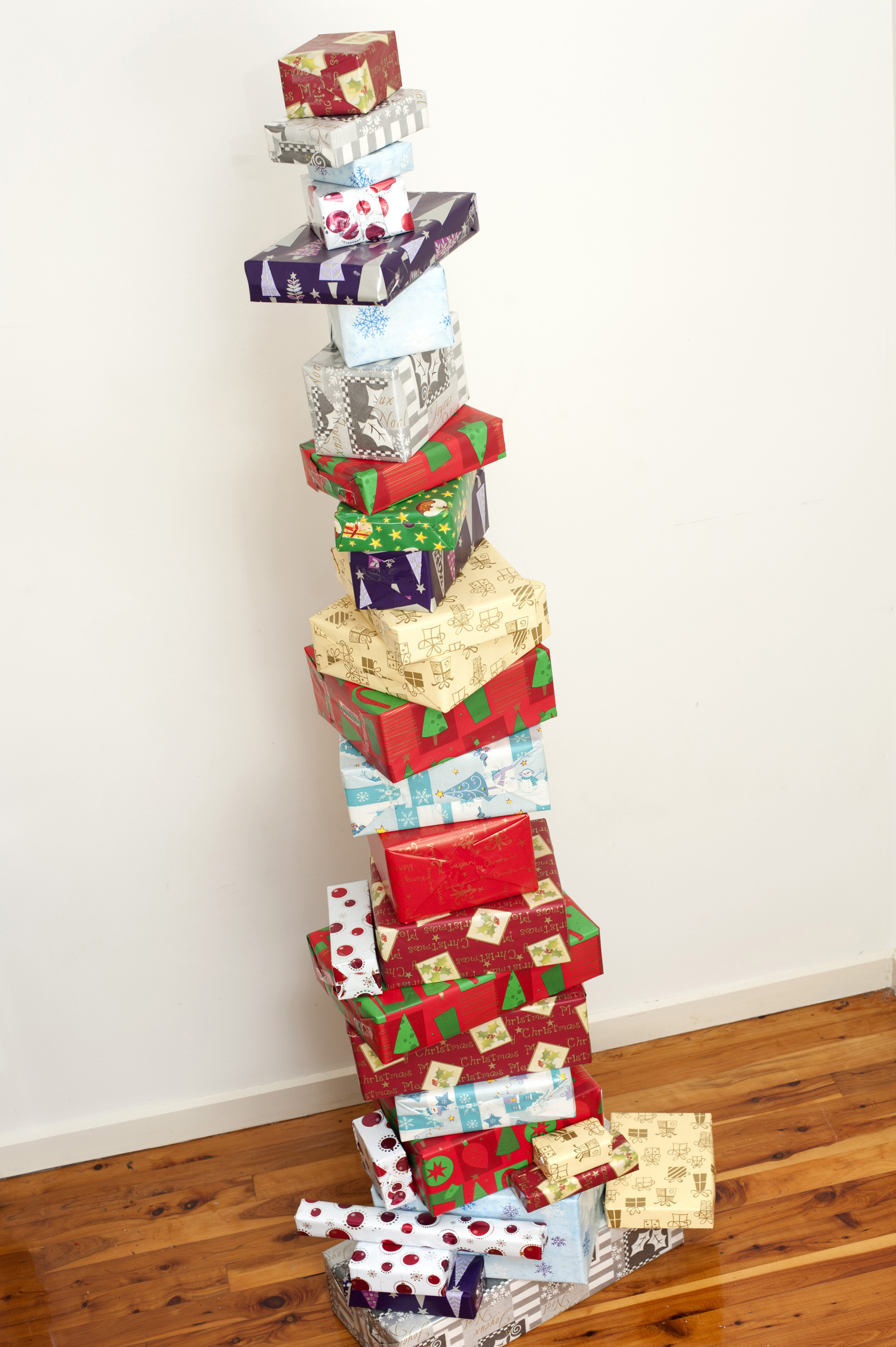 Photo of Stacked tower of colourful Christmas gifts Free christmas images