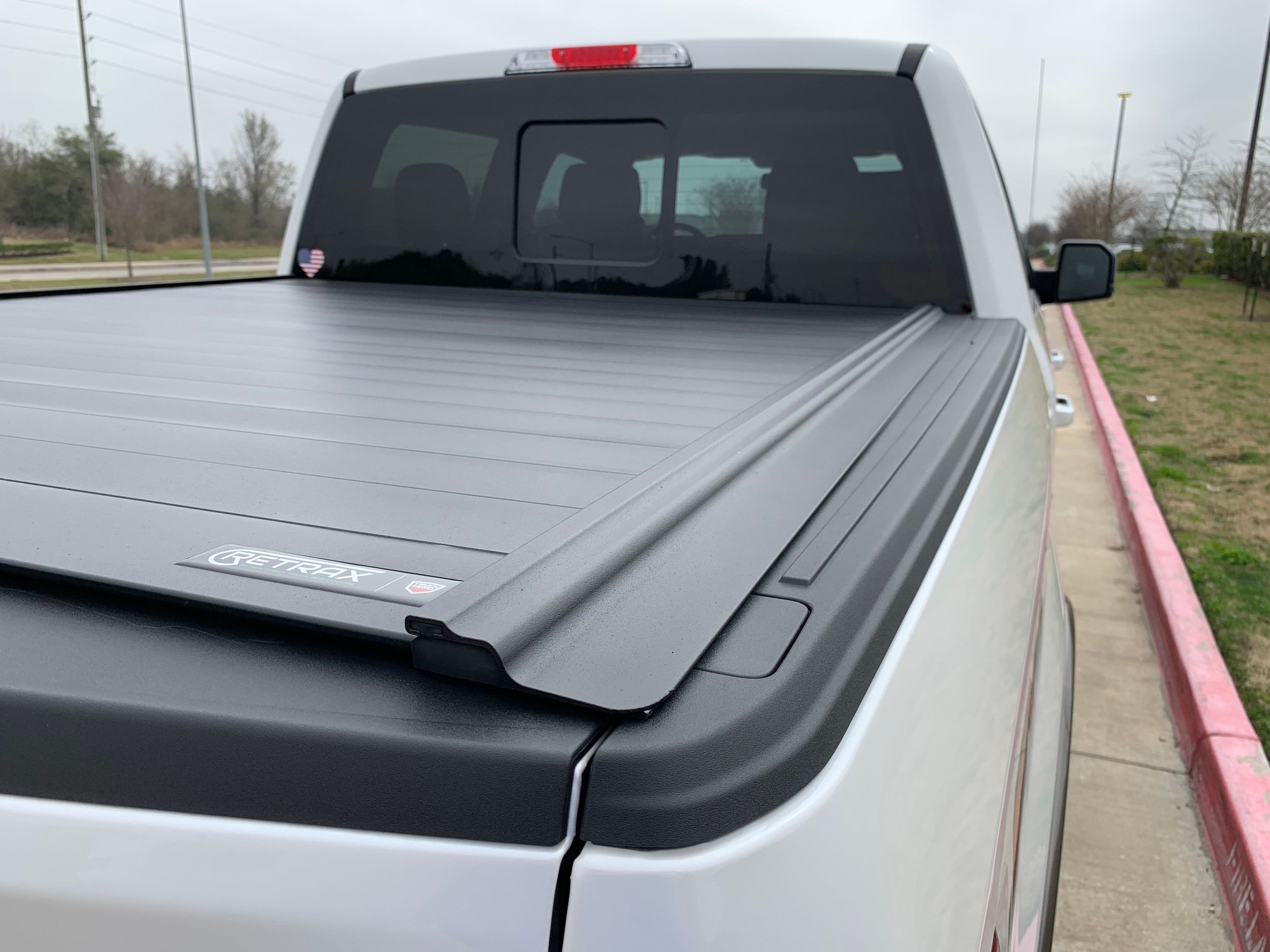 Retrax One MX, Roll N Lock M series, or Pace Edwards Jackrabbit Ford