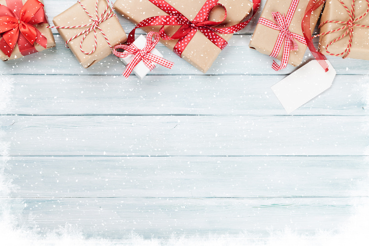 Christmas wooden background with gift boxes and snow Cincinnati