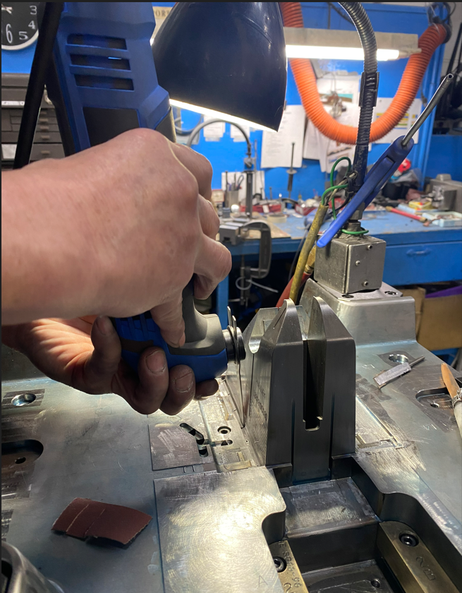 Why is hand polishing still required for a plastic injection mold