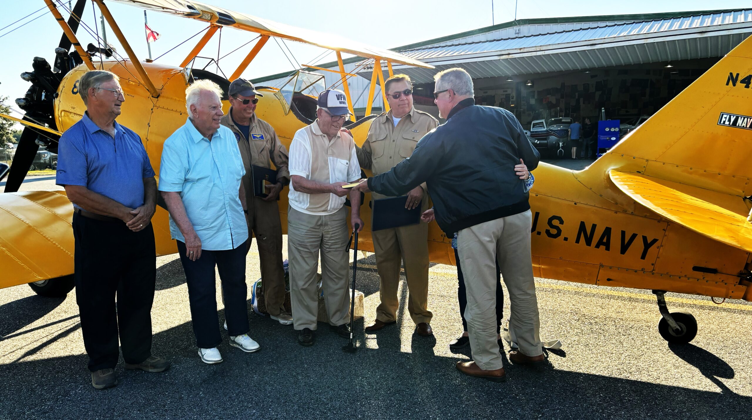 Foley's World War II biplane arrives at airport City of Foley