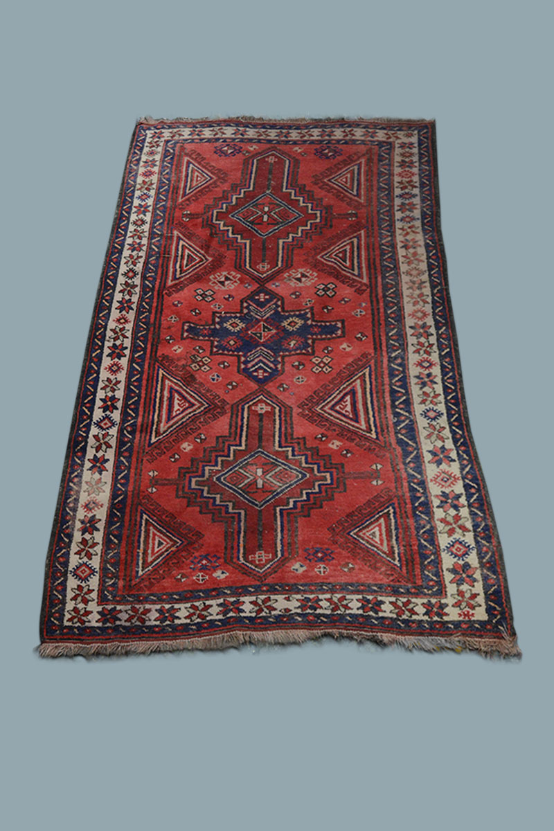 8'4" x 4'6" Blue, Cream & Red Persian Rug The Classic Prop Hire Company