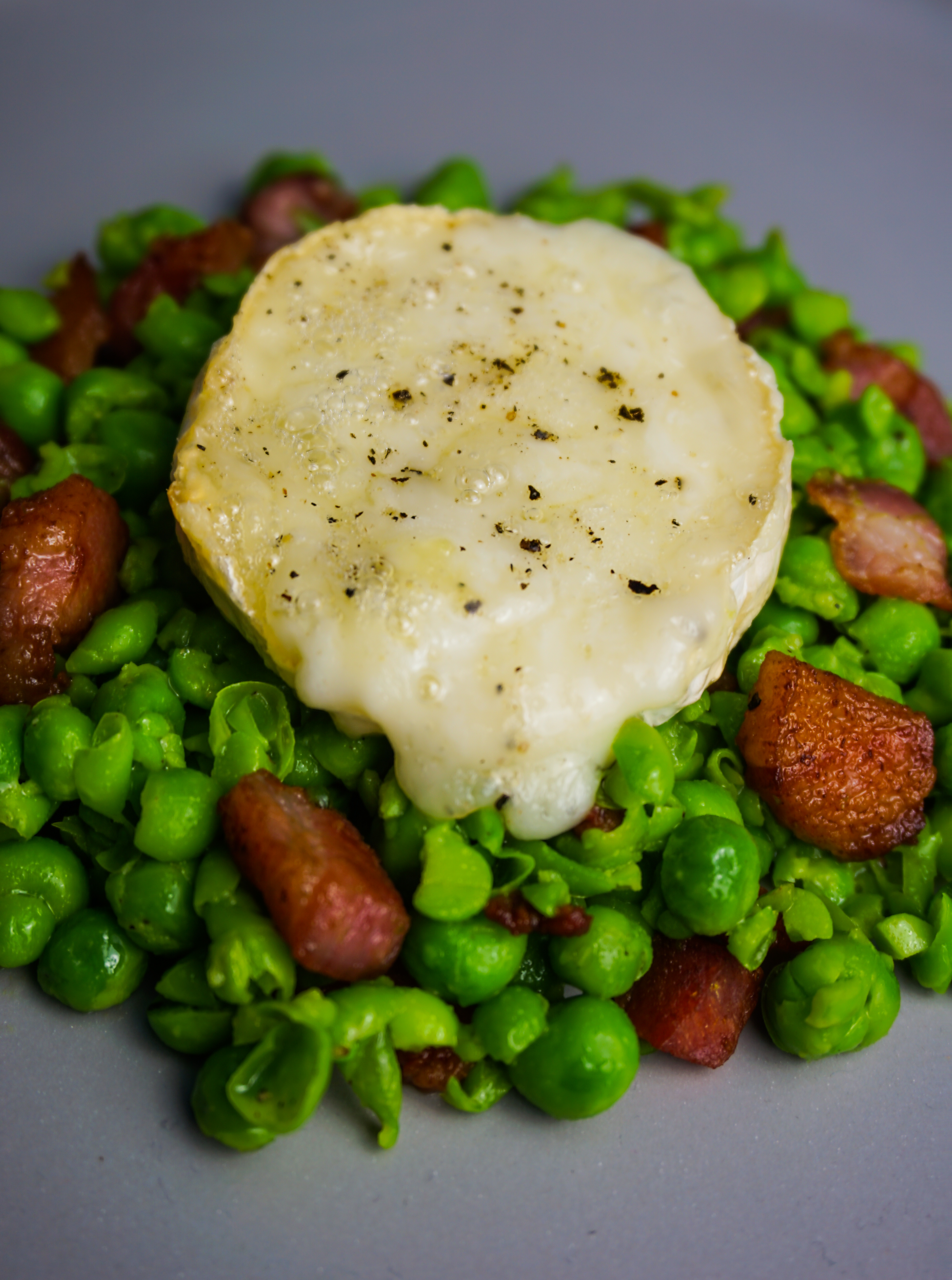 baked goats cheese, pea & pancetta salad