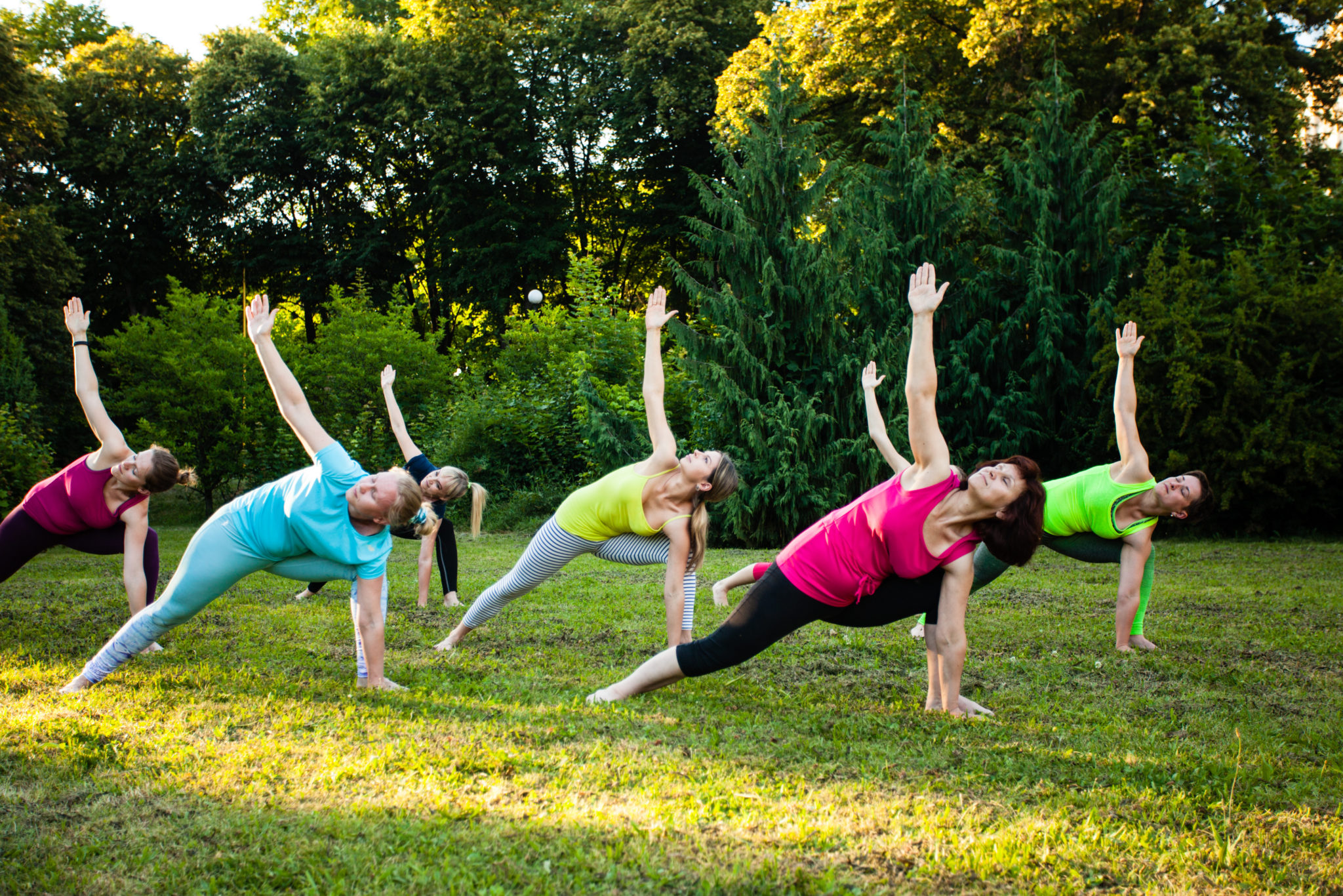 Group of women attending a yoga class outdoors Clean Path Behavioral