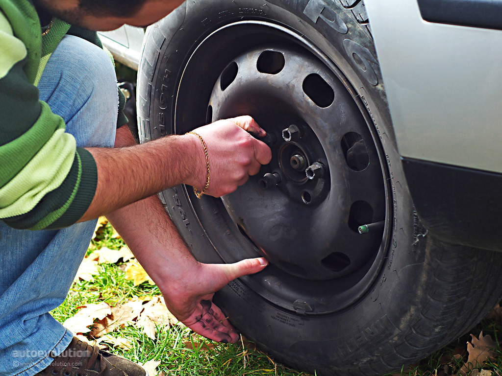 How to change a tire on a car ClickHowTo