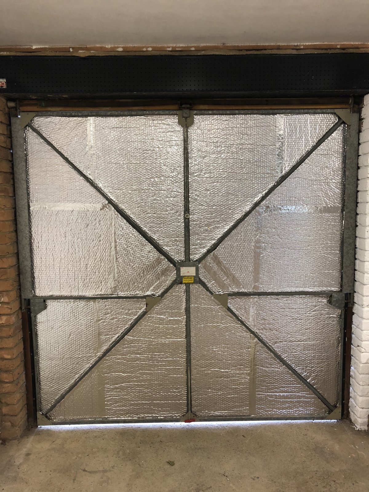 Insulating garage door