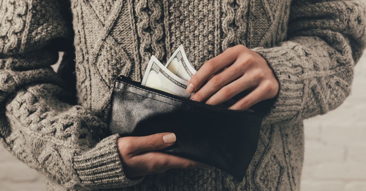 Tools to Help You Save Money - picture of hands reaching into wallet for cash