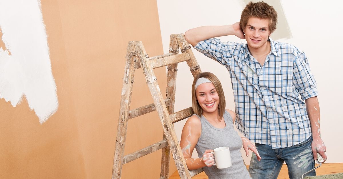 What is a Money Market Account - picture of young couple painting new house