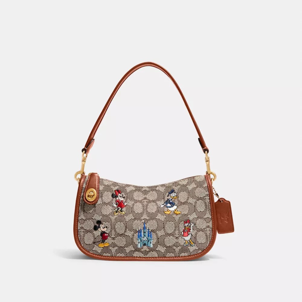 COACH® Disney X Coach Swinger Bag In Signature Textile Jacquard With