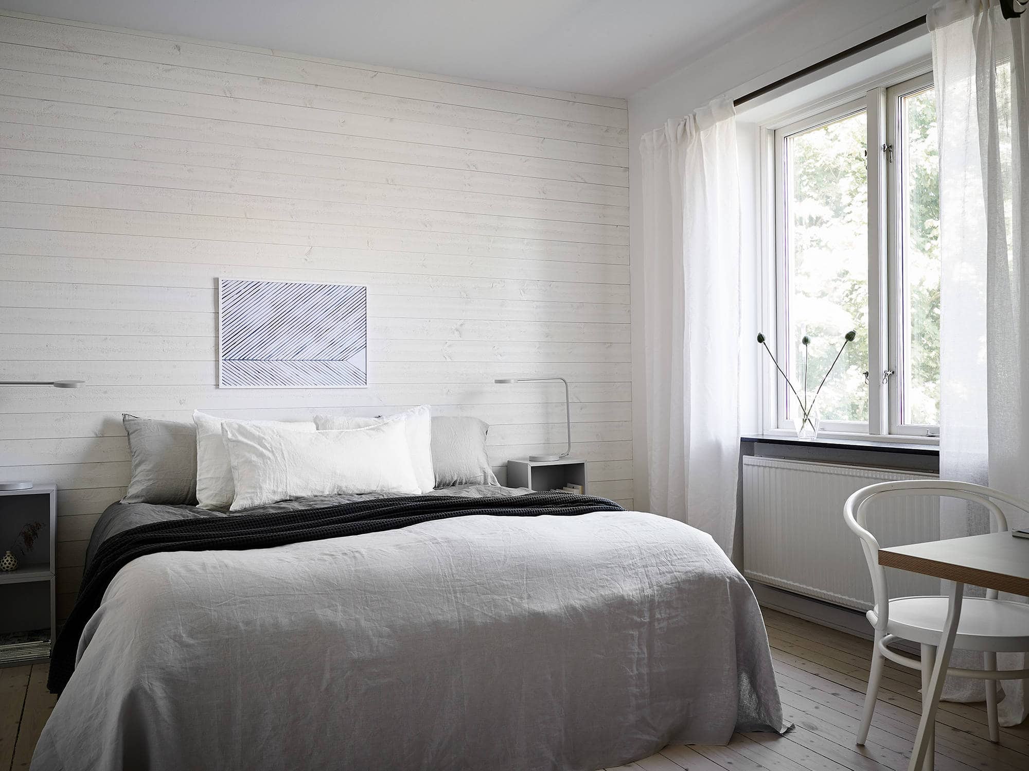 Fresh looking bedroom with a light wooden wall COCO